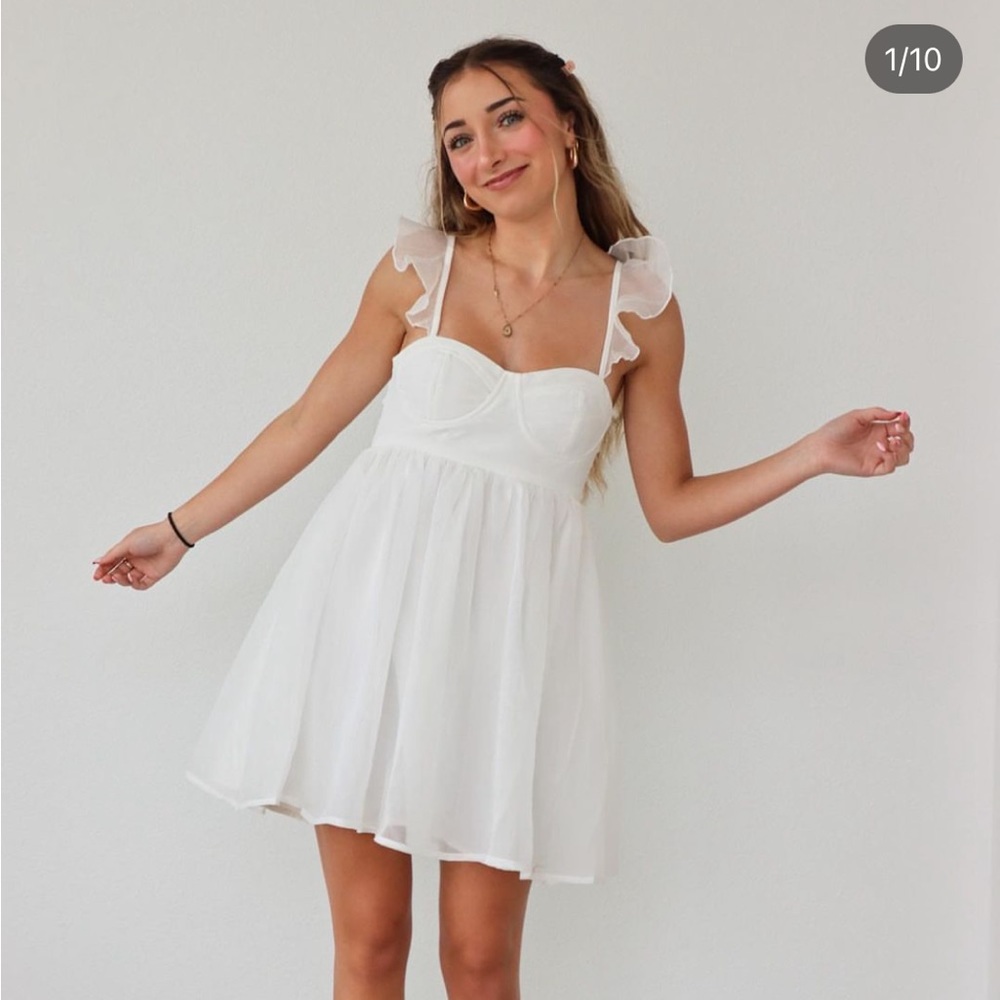 White dress from Lash Next Door by Brooklyn and Bailey. Medium.